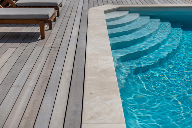 Travertine vs Concrete Pool Deck: Complete Comparison Guide